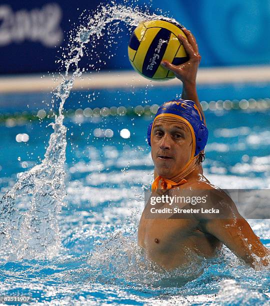 Vladimir Gojkovic of Montenegro attempts a shot against Hungary during a semifinal game of the water polo event at the Ying Tung Natatorium on Day 14...