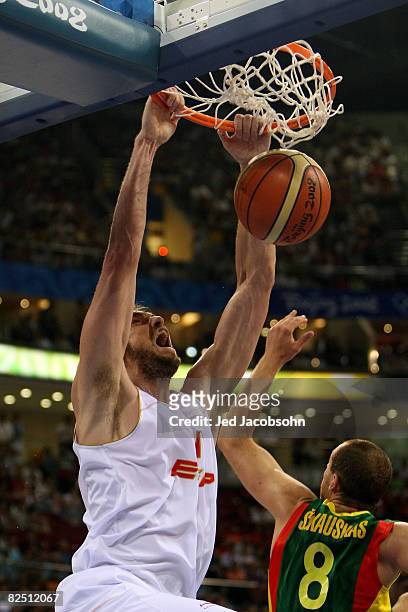 Pau Gasol of Spain dunks against Ramunas Siskauskas of Lithuania during a men's semifinal baketball game at the Wukesong Indoor Stadium on Day 14 of...