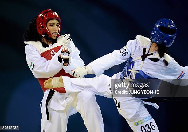 Sheikha Maitha Almaktoum of the United Arab Emirates avoids a kick from Sandra Saric of Croatia in the repechage of the women's -67 kg taekwondo...