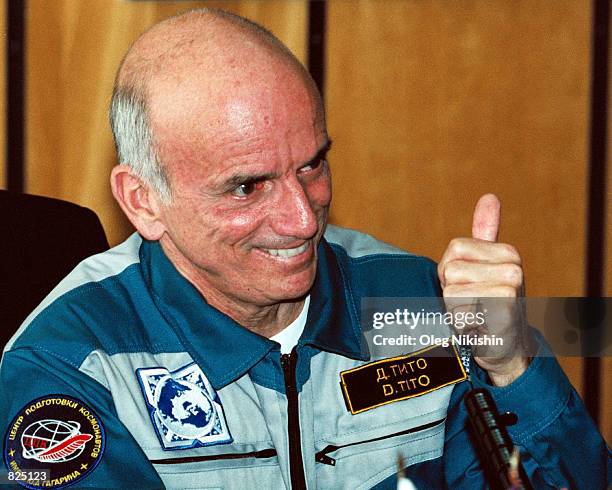 Financer Dennis Tito gestures May 8, 2001 during a post-space flight news conference at Star City outside of Moscow. Tito, the first tourist in...