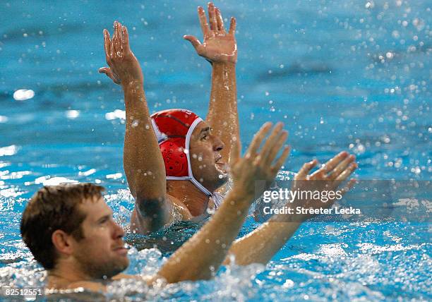 Jeffrey Powers and goalkeeper Merrill Moses of the United States celebrate their win over Serbia in the men's semifinal game of the water polo event...
