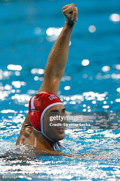 Goalkeeper Merrill Moses of the United States celebrates their win over Serbia in the men's semifinal game of the water polo event at the Yingdong...