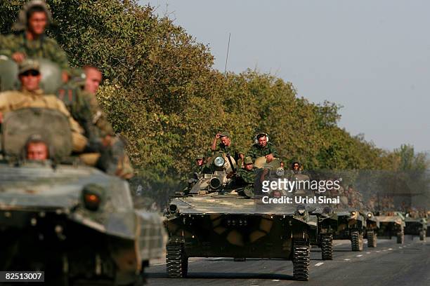Russian soldiers ride an APC , August 22, 2008 near Igoeti, on the road from Tbilisi to Gori, Georgia. Russia is working to a self imposed deadline...