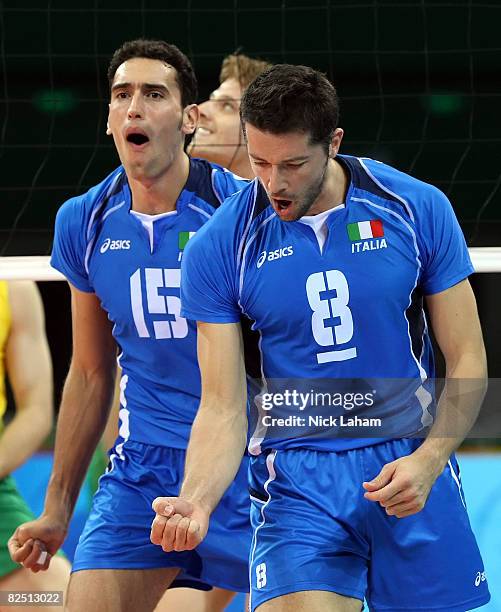 Alberto Cisolla and Emanuele Birarelli of Italy react while taking on Brazil during the semifinal volleyball game at the Capital Indoor Stadium on...