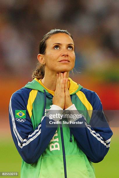 Gold medalist Maurren Higa Maggi of Brazil reacts during the medal ceremony for the Women's Long Jump Final at the National Stadium on Day 14 of the...