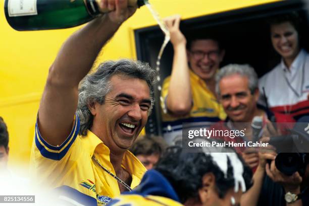 Flavio Briatore, Michael Schumacher, Grand Prix of Germany, Hockenheimring, 25 July 1993. Flavio Briatore pouring champagne on Michael Schumacher.