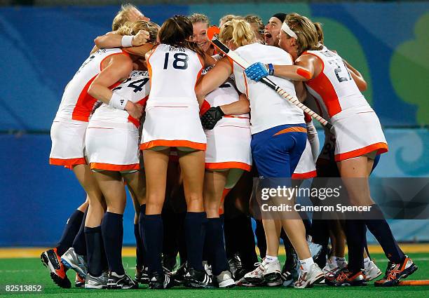 The Netherlands celebrate after their 2-0 victory over China in the women's gold medal hockey match at the Olympic Green Hockey Field on Day 14 of...