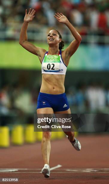 Heather Fell of Great Britain celebrates after finishing second in the 3000m run discipline to win the silver medal in the women's modern pentathlon...