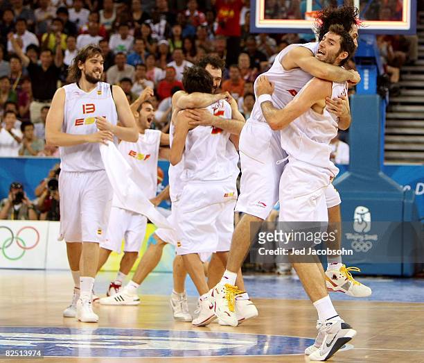 Marc Gasol of Spain celebrates with his teammates after they defeated Lithuania by a score of 91-86 during a men's semifinal baketball game at the...