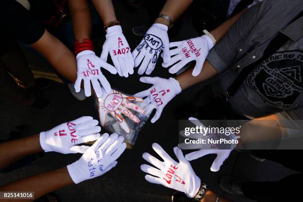 Supporters of ousted former Thai Prime Minister Yingluck Shinawatra waiting for her arrival at the Supreme Court in Bangkok, Thailand on August 1,...