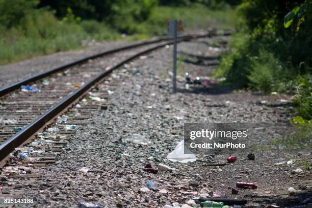 Piles of trash, including thousands of syringes and empty heroin bags, are found at the heroin camp located under the North Second Street overpass,...