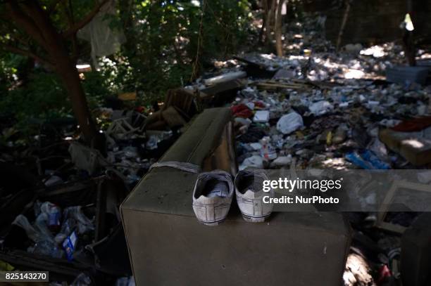 Piles of trash, including thousands of syringes and empty heroin bags, are found at the heroin camp located under the North Second Street overpass,...