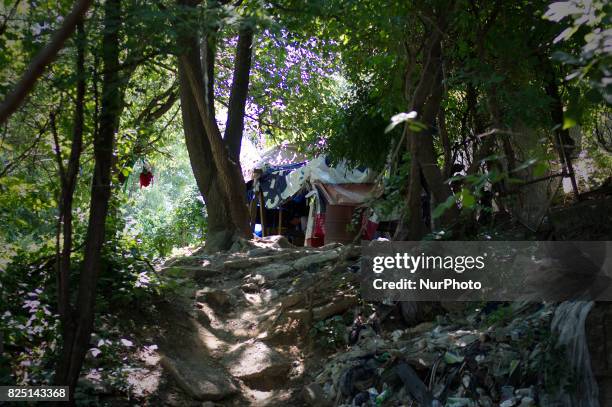 Empty heroin bags, drug paraphernalia and syringes are found between piles of trash at the heroin camp located under the North Second Street...