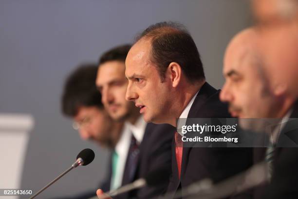Murat Cetinkaya, governor of Turkey's central bank, center, speaks during a news conference in Ankara, Turkey, on Tuesday, Aug. 1, 2017. Turkeys...