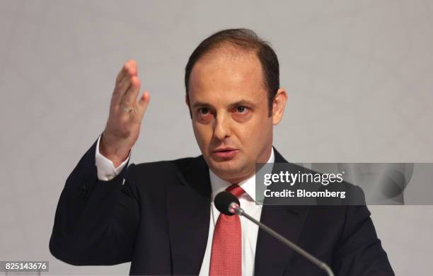 Murat Cetinkaya, governor of Turkey's central bank, gestures as he speaks during a news conference in Ankara, Turkey, on Tuesday, Aug. 1, 2017....