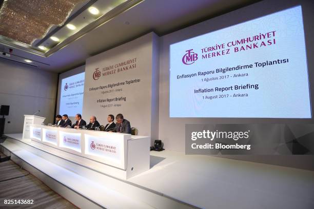 Murat Cetinkaya, governor of Turkey's central bank, center, and colleagues attend a news conference in Ankara, Turkey, on Tuesday, Aug. 1, 2017....