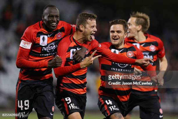 Oriol Riera of the Wanderers celebrates with team mates after scoring a goal in extra time during the FFA Cup round of 32 match between the Western...