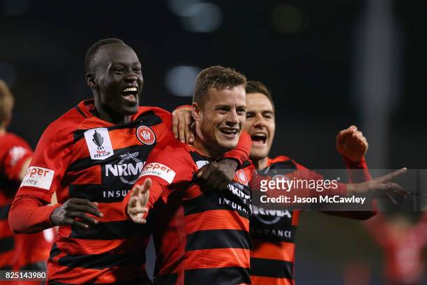 Oriol Riera of the Wanderers celebrates with team mates after scoring a goal in extra time during the FFA Cup round of 32 match between the Western...