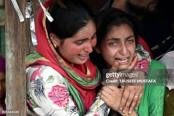 Kashmiri villagers mourn during a funeral of rebel Arif Lelhari at Lelhar village in Pulwama, south of Srinagar, on August 1, 2017. - Indian forces...