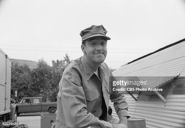 American actor Jim Nabors smiles outside a Quonset hut during the filming of an episode of the television comedy series 'Gomer Pyle, USMC' entitled...