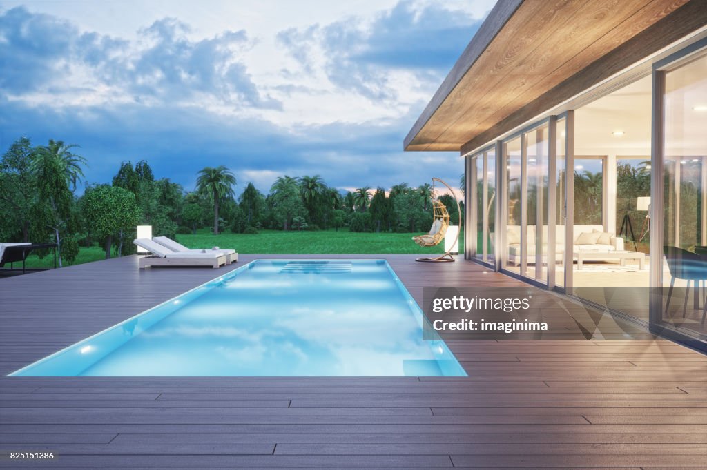 Modern Luxury House With Swimming Pool At Dawn