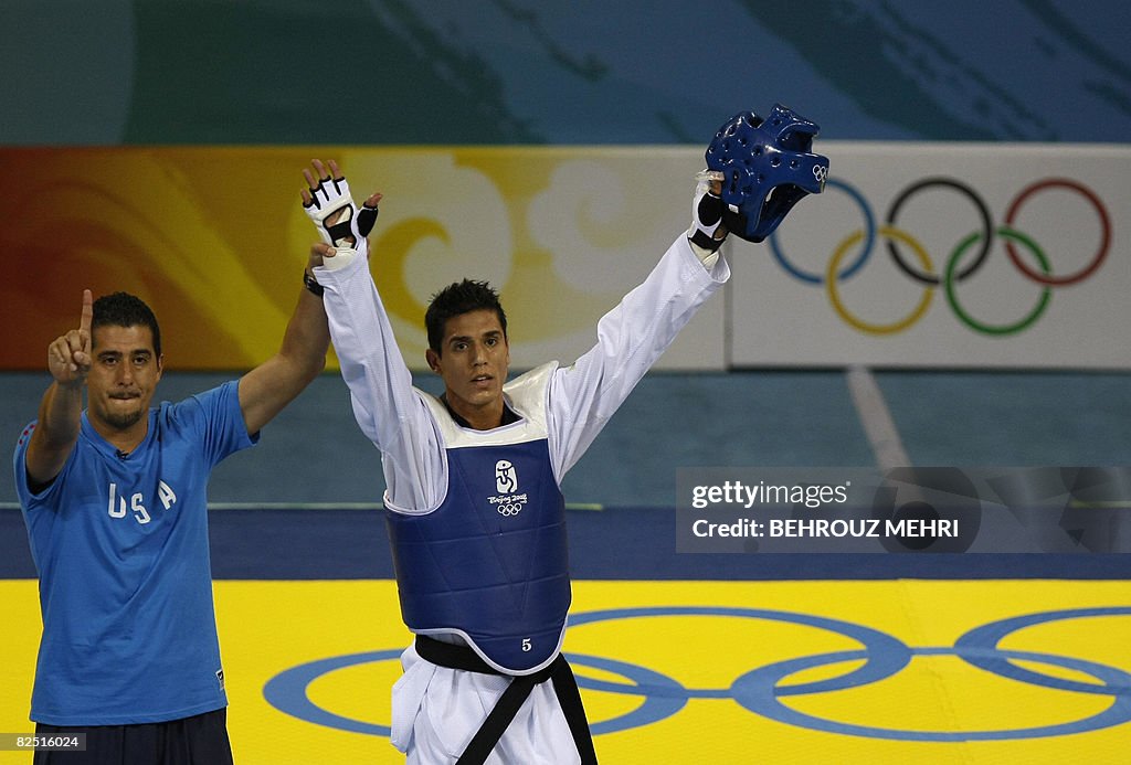US coach Jean Lopez rises hand of his br