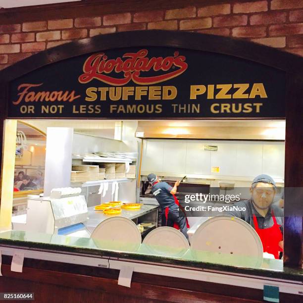 orders being prepared at giordano's pizza in chicago - deep dish pizza stock pictures, royalty-free photos & images