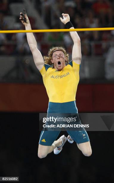 Australia's Steve Hooker celebrates taking gold in the men's pole vault final at the "Bird's Nest" National Stadium during the 2008 Beijing Olympic...