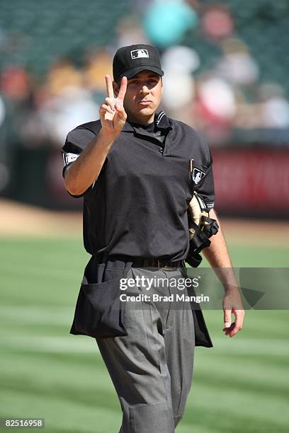 Home-plate umpire James Hoye makes a call during the game between the Oakland Athletics and the Tampa Bay Rays at the McAfee Coliseum in Oakland,...