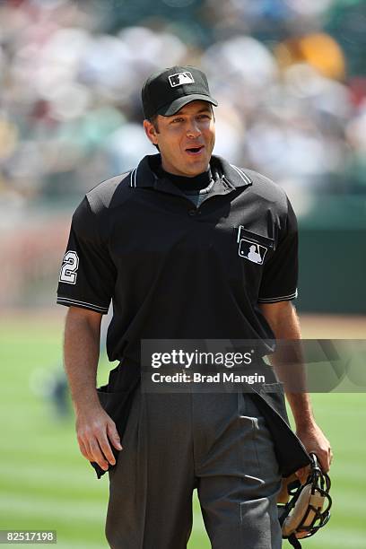 Home-plate umpire James Hoye stands on the field during the game between the Oakland Athletics and the Tampa Bay Rays at the McAfee Coliseum in...