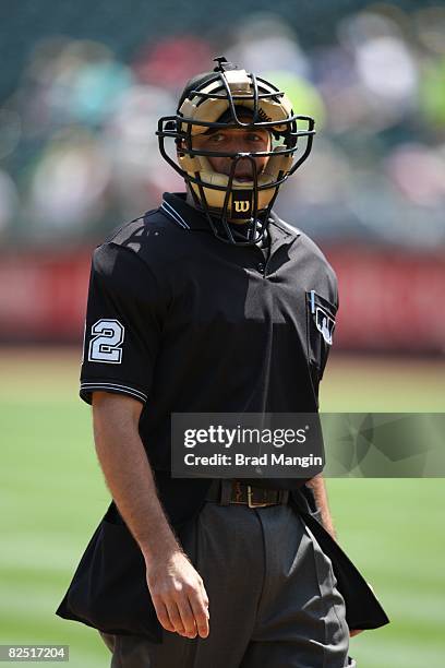 Home-plate umpire James Hoye stands on the field during the game between the Oakland Athletics and the Tampa Bay Rays at the McAfee Coliseum in...