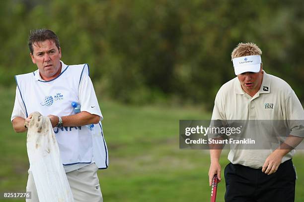 Ross McGowan of England with aillling caddie Mick Donaghy on the 17th hole during second round of The KLM Open at Kennemer Golf & Country Club on...