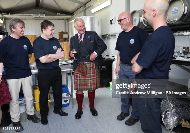 The Prince of Wales, known as the Duke of Rothesay while in Scotland, tries a pint of Swelkie Golden Ale with co-owners Alan Farquhar, Andrew Mowat,...