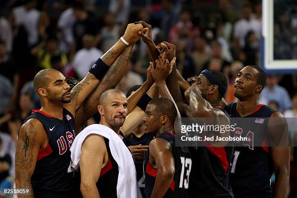 Carlos Boozer, Jason Kidd, Chris Paul, LeBron James and Dwight Howard of the United States huddle with their teammates after they defeated Argentina...