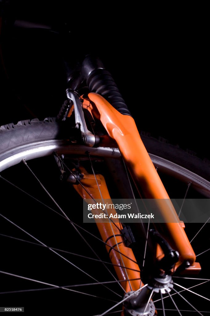 Front wheel of bike on black background