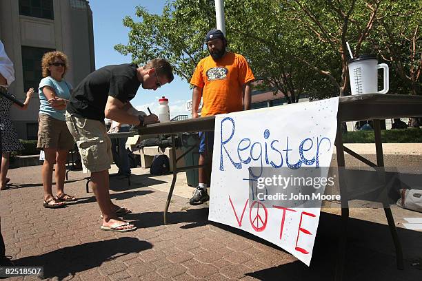 College student fills out a form during a voter registration drive August 22, 2008 in Denver, Colorado. The Democratic National Convention starts in...