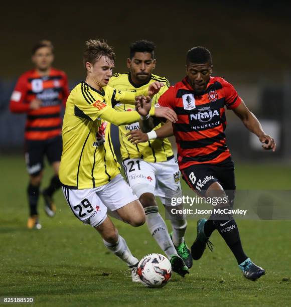 Luke Tongue of the Phoenix and Roly Bonevacia of the Wanderers compete for the ball during the FFA Cup round of 32 match between the Western Sydney...