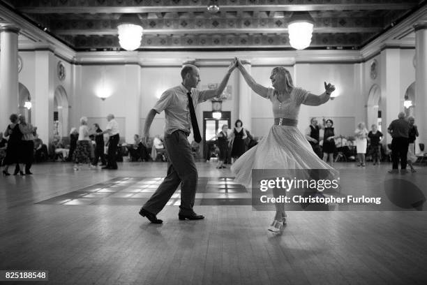 People take part in a tea dance at Sheffield's City hall on August 1, 2017 in Sheffield, England. The popular tea dance session coincides with the...