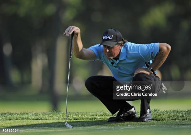 Phil Mickelson lines up a putt during the second round of The Barclays held at the Ridgewood Country Club on August 22, 2008 in Paramus, New Jersey....