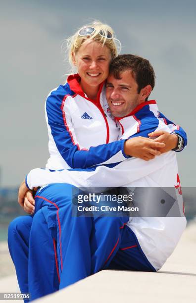 Gold medal winning Yngling skipper Sarah Ayton of Great Britain poses with her fiancee RS:X windsurfer Nick Dempsey at the Qingdao Olympic Sailing...
