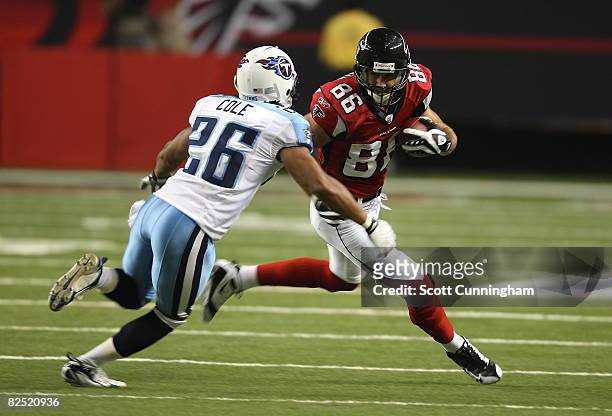 Brian Finneran of the Atlanta Falcons runs with a reception against Marquice Cole of the Tennessee Titans at the Georgia Dome on August 22, 2008 in...