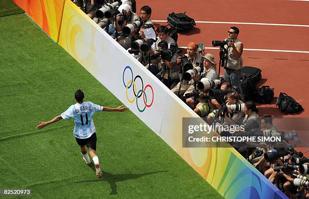 Argentinian midfielder Angel Di Maria celebrates after scoring the opening goal in the men's Olympic football final Argentina vs. Nigeria at the...