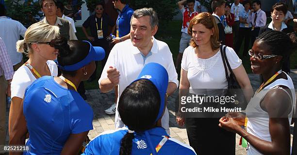 Prime Minister Gordon Brown and his wife Sarah talk with Christine Ohuruogu and other members of the Women's 4 x 400m team during a meeting with Team...