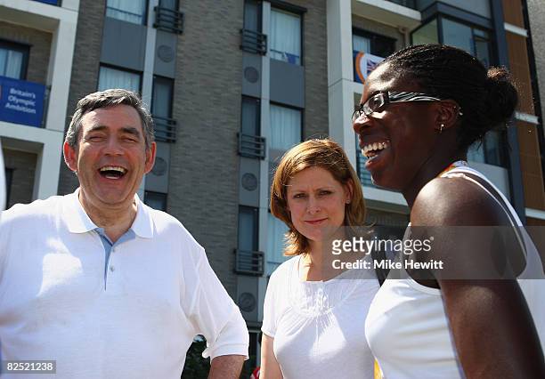 Prime Minister Gordon Brown and his wife Sarah laugh with Women's 400m gold medalist Christine Ohuruogu of Great Britain during their meeting with...