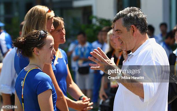 Prime Minister Gordon Brown talks with gold medal winning cyclist Victoria Pendelton of Great Britain during a tour of the Team GB quarters of the...