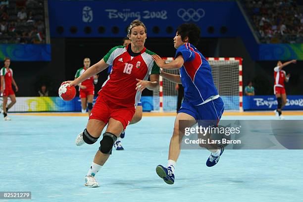 Piroska Szamoransky of Hungary is challenged by Kim Ona of South Korea during the Women's Handball Bronye Medal match between South Korea and Hungary...