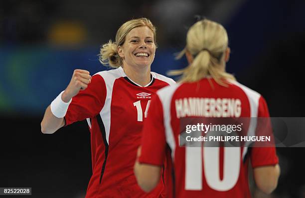 Norway's Tonje Larsen and Gro Hammerseng celebrate after scoring against Russia during the women's handball gold medal match of the 2008 Beijing...