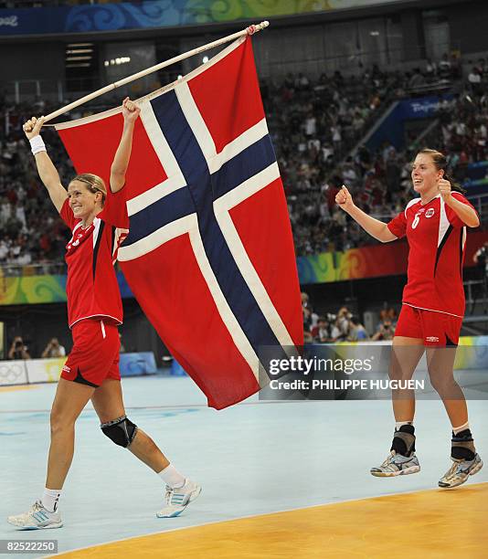 Norway's Gro Hammerseng and Else Marthe Soerlie Lybekk celebrates after defeating Russia in the women's handball gold medal match of the 2008 Beijing...
