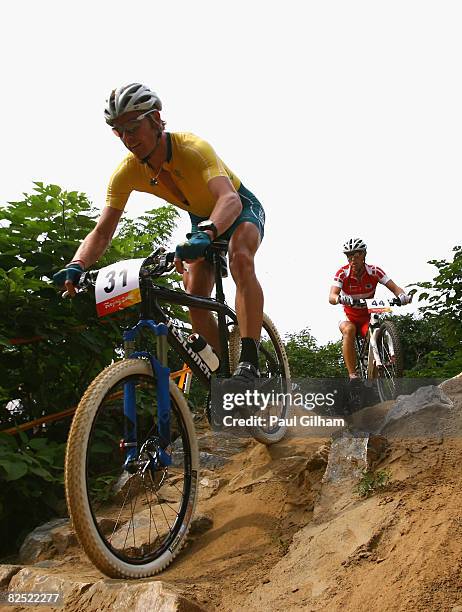 Daniel McConnell of Australia and Klaus Nielsen of Denmark compete in the Men's Cross Country mountain bike cycling event held at the Laoshan...