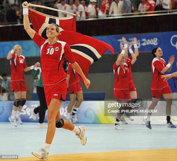 Norway's Gro Hammerseng celebrates after defeating Russia in the women's handball gold medal match of the 2008 Beijing Olympic Games on August 23,...